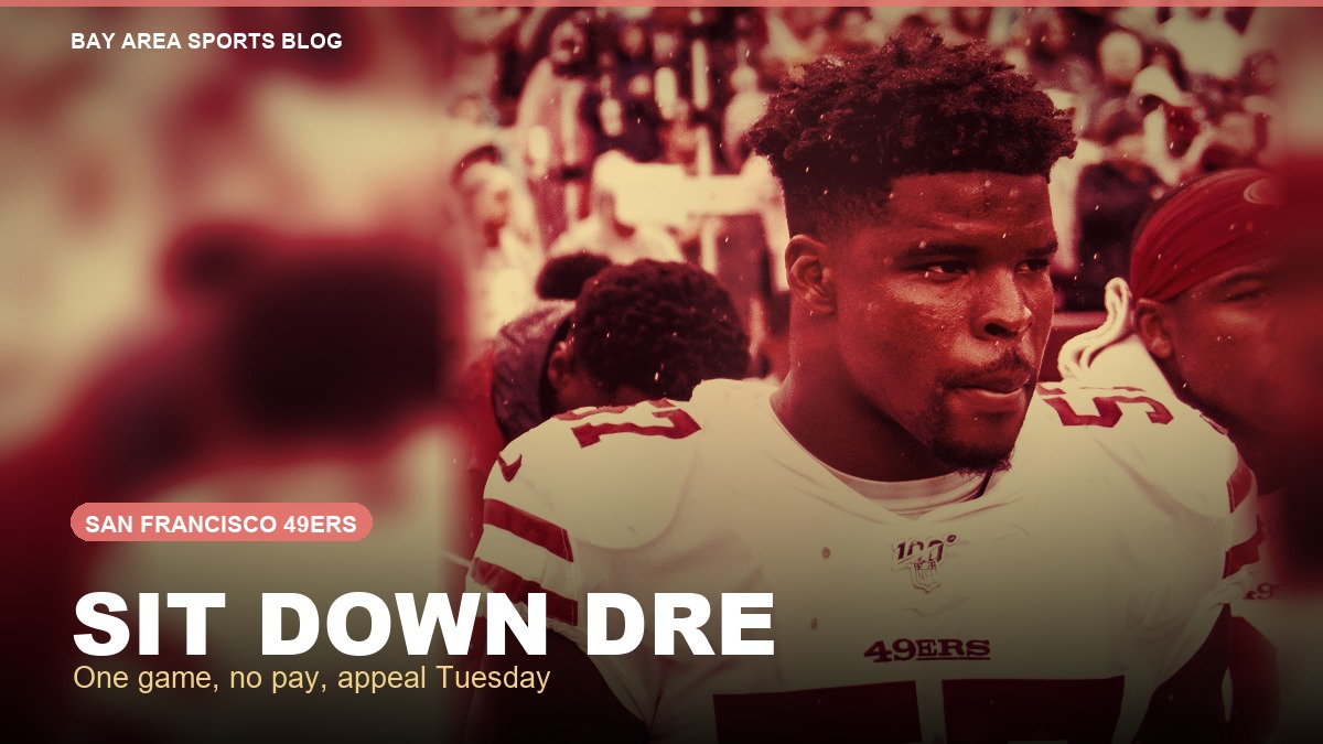 Dre Greenlaw in a 49ers jersey behind the words Sit Down Dre