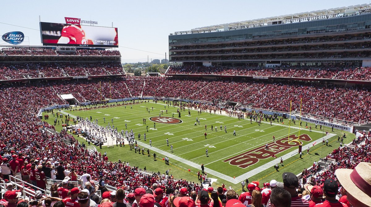 Elevated view across a full Levi's Stadium during a Broncos and 49ers game, with the 49ers end zone in the foreground