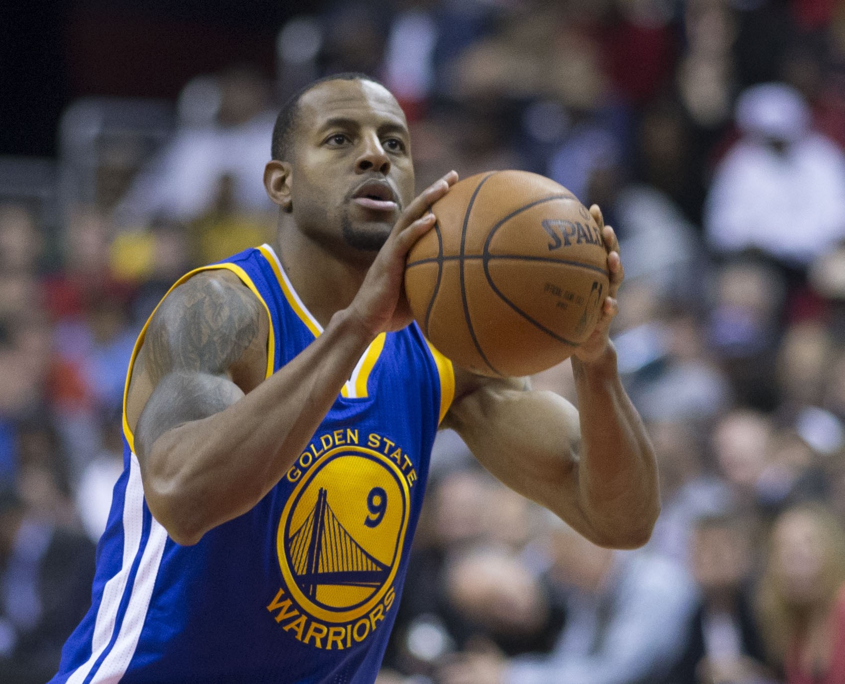 Andre Iguodala in a blue Golden State Warriors number 9 jersey squaring up a free throw