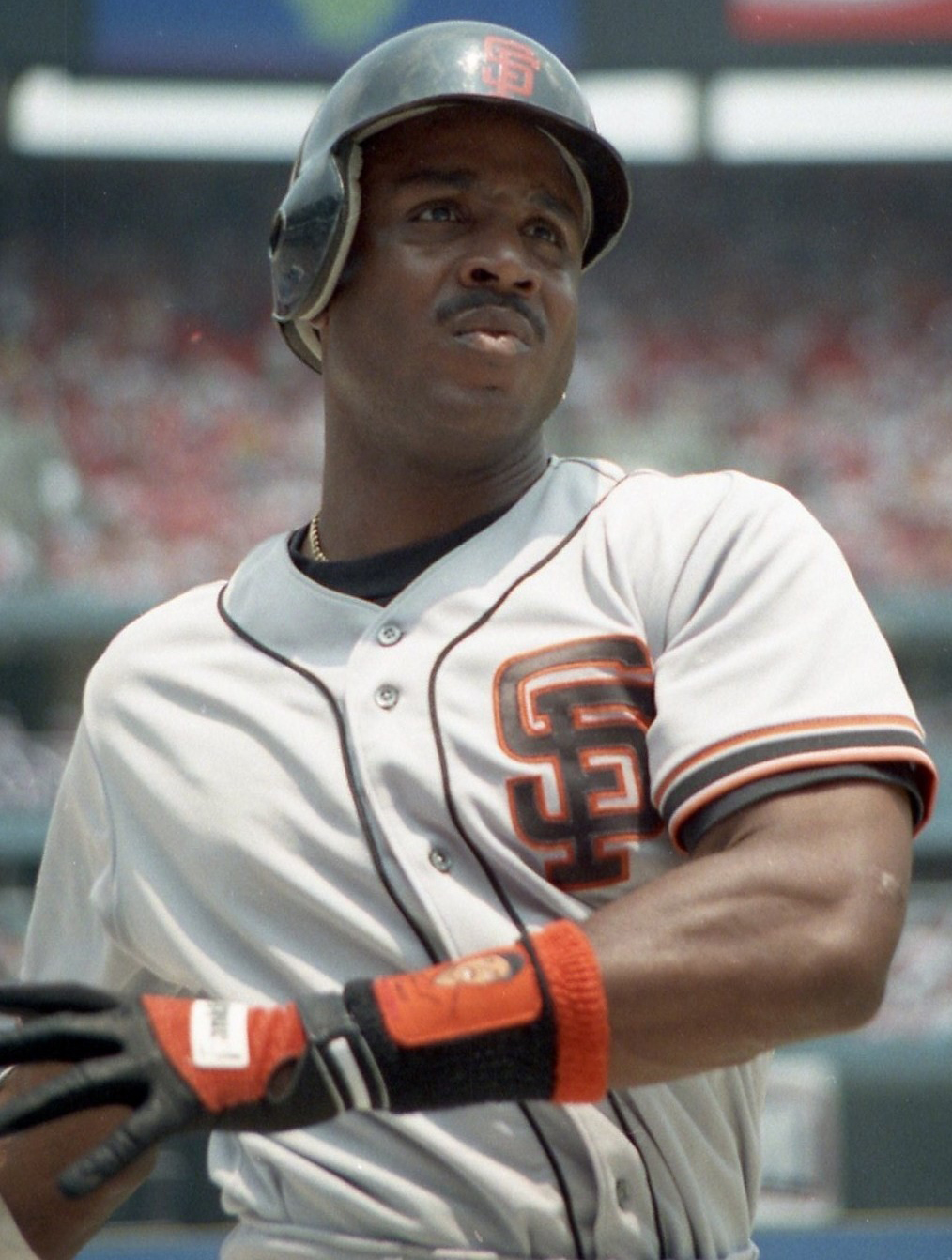Barry Bonds in a gray San Francisco Giants road uniform and batting helmet, on deck in 1993