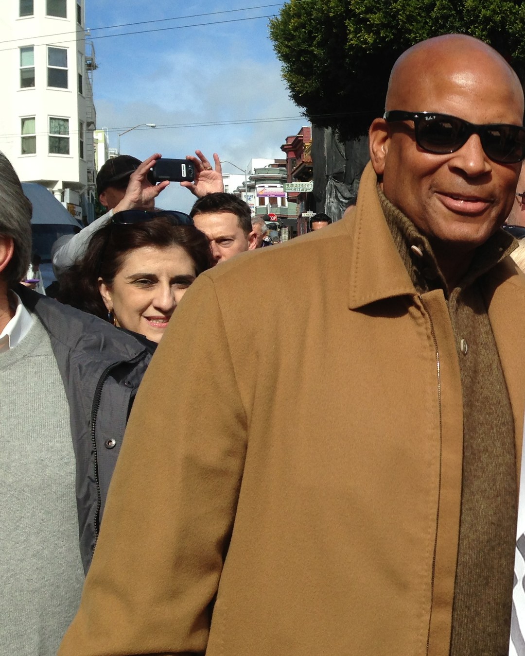 Ronnie Lott smiling with 49ers fans in San Francisco