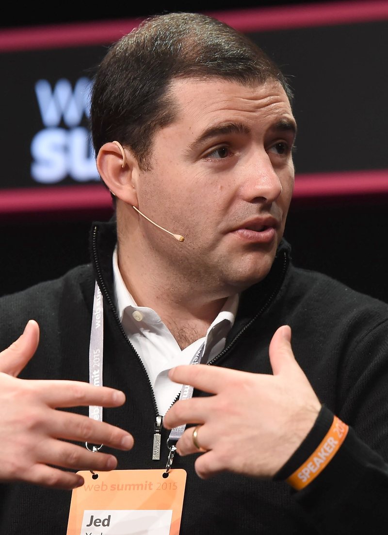 Portrait of 49ers owner Jed York wearing a black sweater and a speaker lanyard at Web Summit