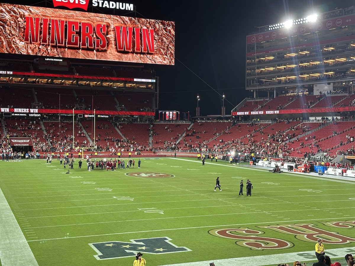 Levi's Stadium at night with the video board reading NINERS WIN after a home game
